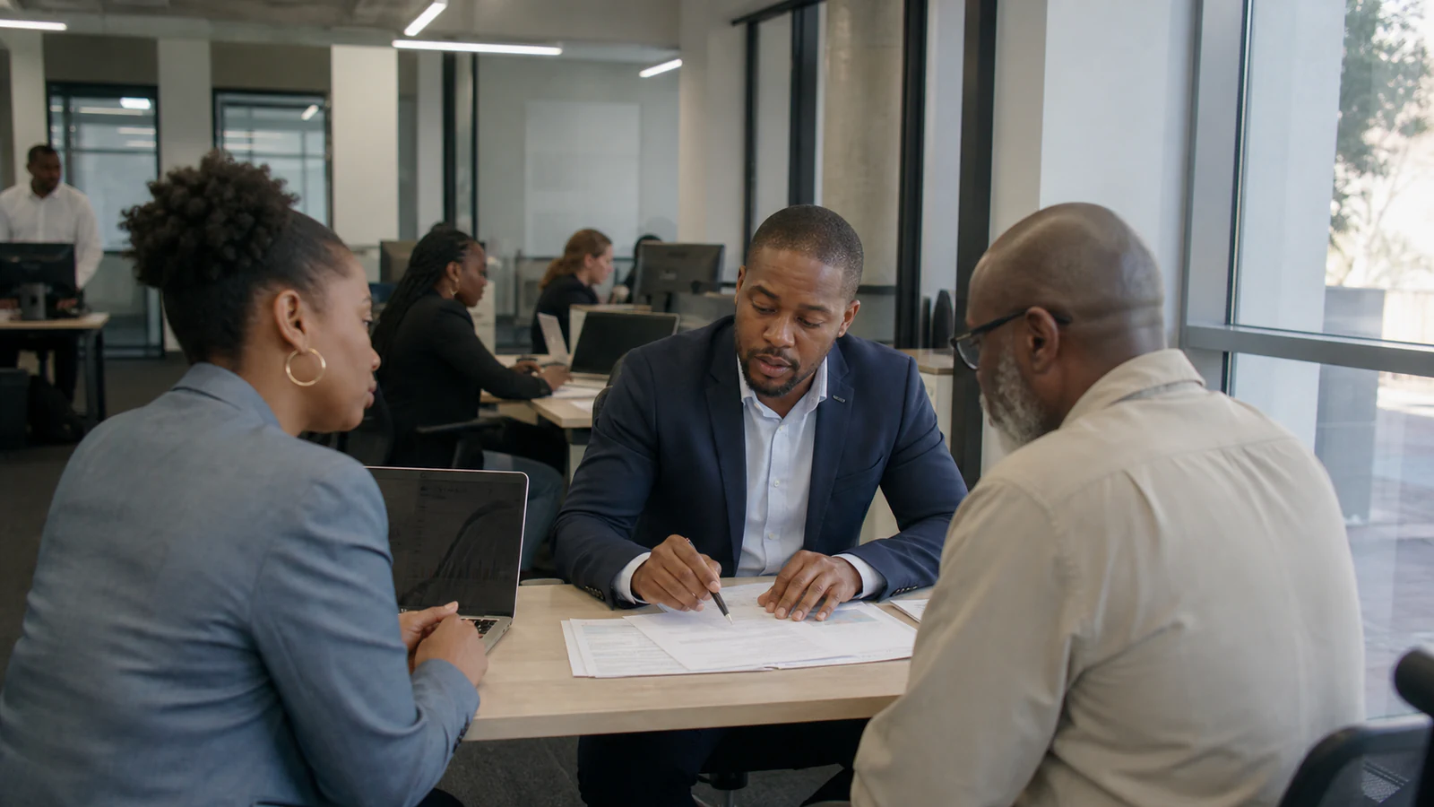 South African investment and insurance professionals reviewing market performance in Johannesburg.